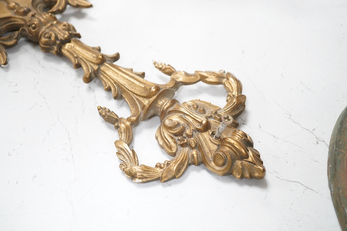A set of four Louis XVI style three branch gilt bronze wall lights, 62.5cm high x 40cm wide